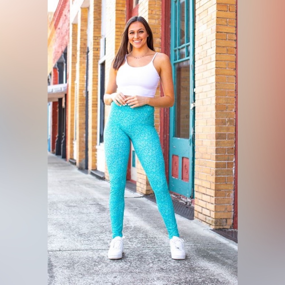 L&B turquoise leggings with tooled leather pattern. Size medium